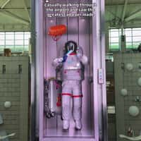 Astronaut Leaps for Flying Ticket in Elevator