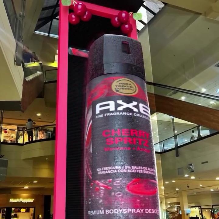 Axe Bottle Rotates as Banner Rolls