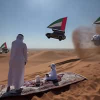 Nissan Cars with UAE Flags Drift on Dunes