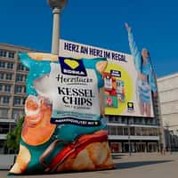 EDEKA Model Tosses Chips From Billboard