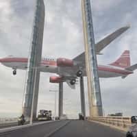 Quoifaireabordeaux Suspended Plane Above the Bridge