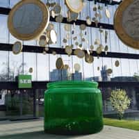 SEB Coins On Thread Hang Above Jar