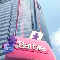 Vivo Barbie Handbag Hanging on Skyscraper