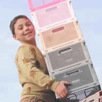 HEMA Kid Standing on Stack Boxes Tower