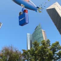 Walmart Airship Floats Above Skyscraper