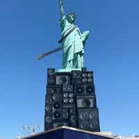 Lenny Kravitz Guitar Hangs on Statue of Liberty
