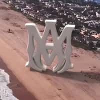 AMIRI Inflatable Logo at the Beach