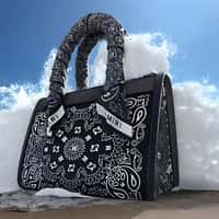 AMIRI Black Bag Wave Splash at the Beach