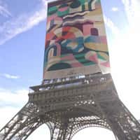 Ville De Paris Banner Rolls Down the Eiffel Tower