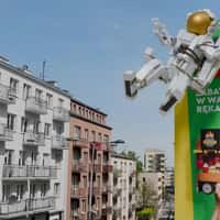 LEGO Astronaut Grabbed by Hand in Billboard