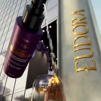 Eudora Hair Spray Held by Robotic Arm