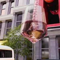 Schweppes Bottle Pours into Glass on Wagon