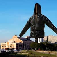 Reserva Black Jacket Hanging from Industrial Chimney