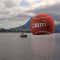 Claro Red Tennis Ball Rolls on the Lake