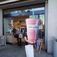 Erewhon Woman Carries Smoothie Cup