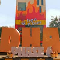 Hen N' Bun Hen Resting on Bucket