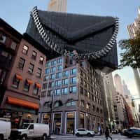 Michael Kors Crane Places Bag on Building