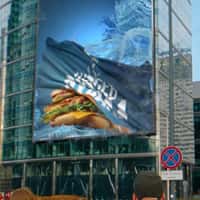 North Fish Fisherman's Burger Emerges in Water from Building