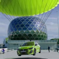 Peugeot Green Car Descends by Parachute at Seine Musicale