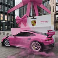 Porsche Pink Car Drives Out of Giant Box