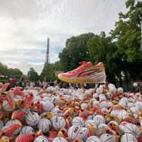 Puma Sneakers and Basketballs Rain Over Eiffel Tower Court