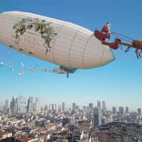 Reis Airship Pulled by Santa Sleigh Over City