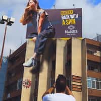 Roadster Diner Woman Steps Out of Billboard