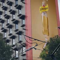 Schweppes Woman Balances on Tightrope