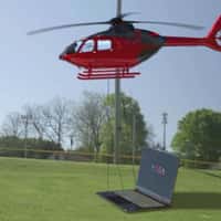 Lenovo Helicopter Carrying Laptop to Ground