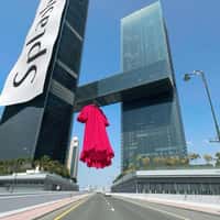Splash Fashions Giant Red Dress Hangs in Dubai Gate Towers