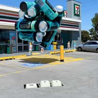 Flipside Energy Giant Cans in Front of 7-Eleven