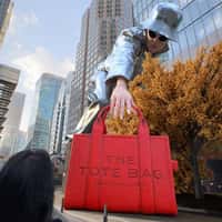 Marc Jacobs Giant Model Picks Up Red Tote Bag