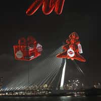 MediaMarkt Inflatables Hover Above Erasmus Bridge