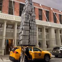 Monos Towering Suitcase on Cab Roof