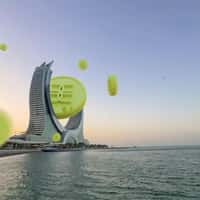Gold Apple Giant Coin Lands on Katara Towers