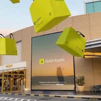 Gold Apple Giant Bags Burst from Billboard