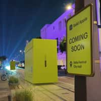 Gold Apple Giant Boxes on Tramway Tracks