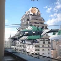 Michael Kenedy Giant Watch Tops Building