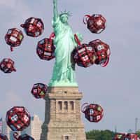 Happy Socks Giant Christmas Balls Fall at Statue of Liberty