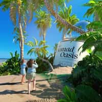 Primark Giant Bottle and Oasis Emerge from Sand