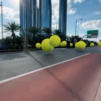 Mubadala Giant Tennis Balls Roll Through Abu Dhabi