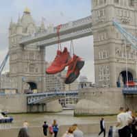 Adidas Giant Shoes Hanging on Tower Bridge