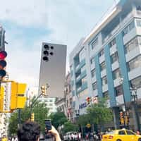 Samsung Giant Phone and S Pen Hover Over City