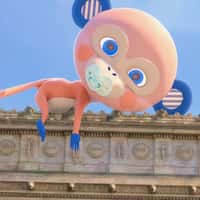 Biolane Monkey Mascot Gets Pacifier Atop the Arc de Triomphe