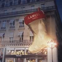 Lancel Santa Puts Bags into Giant Christmas Sock