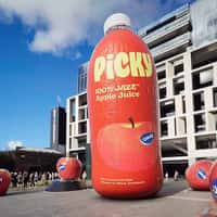 Picky Giant Apple Inflated into Giant Bottle