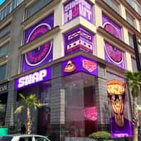 SNAP Giant Pizza Character Pops Up Behind Building