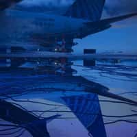 United Airlines Tail Reflected Upside Down in Snow