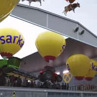 Sarkamessut Cows and Tractors Carried by Hot Air Balloons