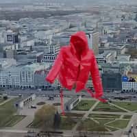 MMC Red Jacket Flying Above Warsaw